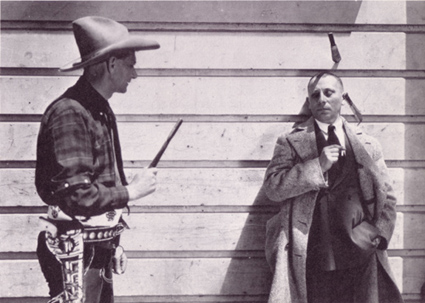 Bee Ho Gray throwing knives at Erich von Stroheim